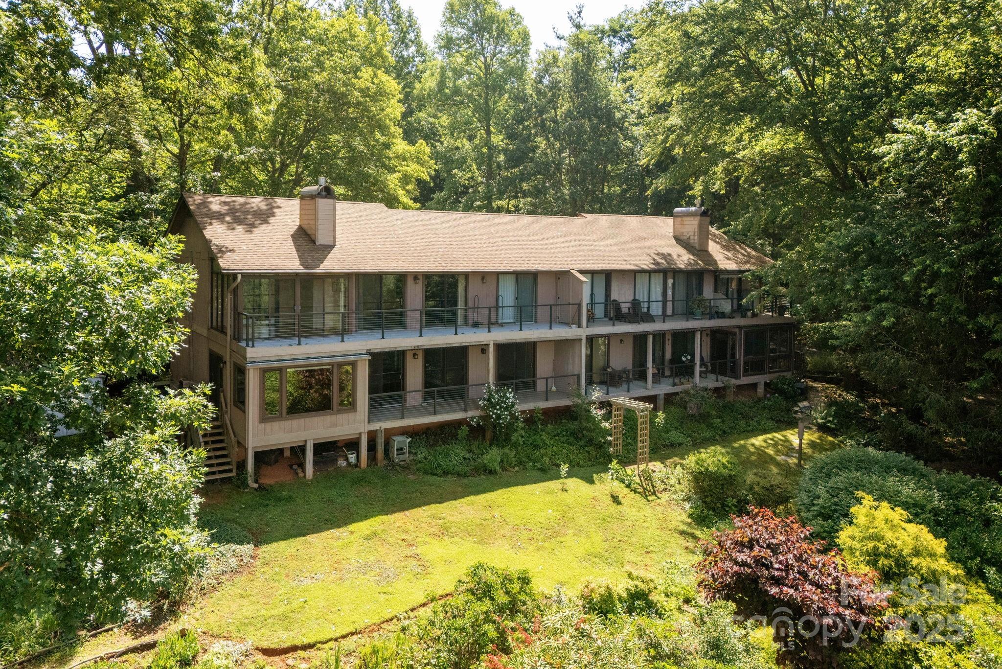 524 Three Mile Knob Road, Unit 3 Pisgah Forest, NC 28768 - Photo 33 of 33 front view of a house with a yard table and chairs