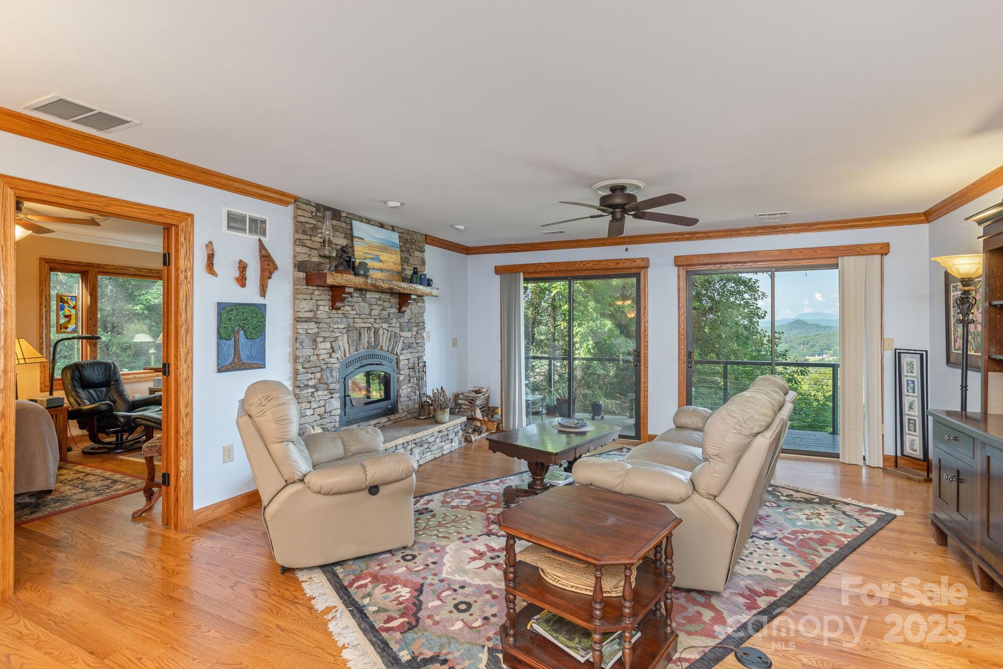 524 Three Mile Knob Road, Unit 3 Pisgah Forest, NC 28768 - Photo 9 of 33 a living room with fireplace furniture and a large window