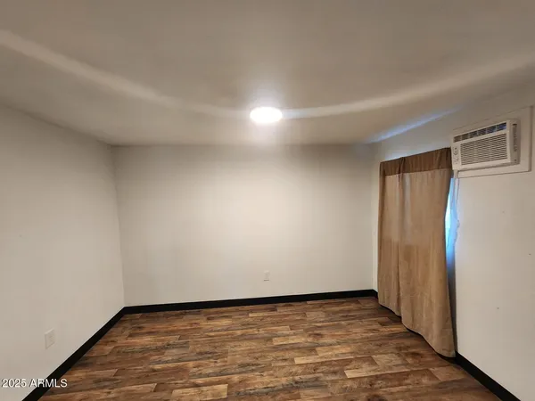 a view of an empty room and window