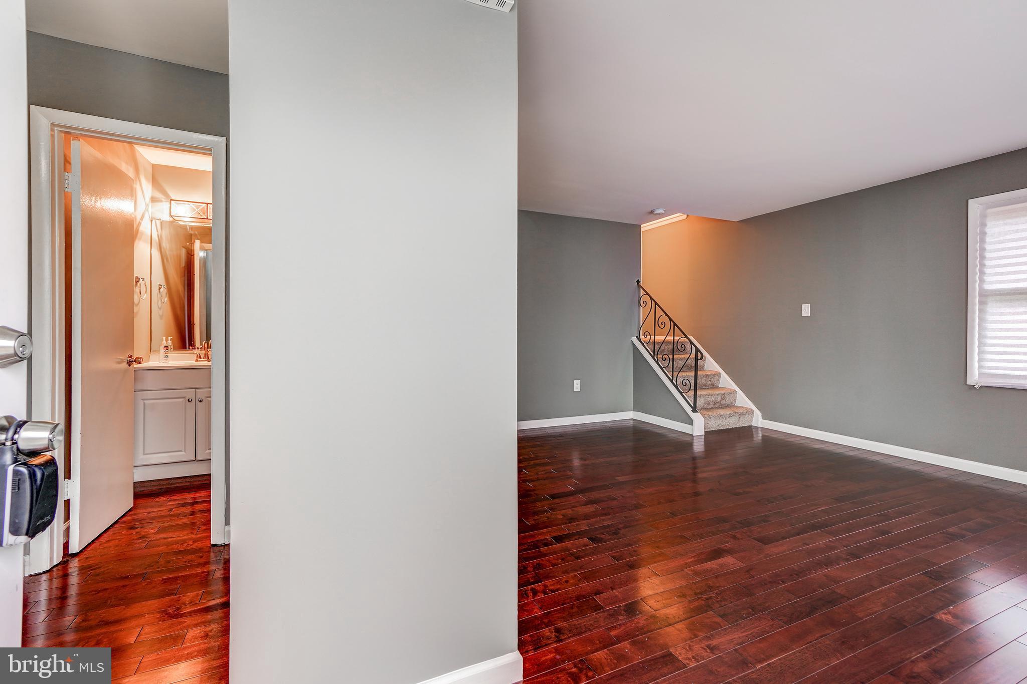 7610 Carissa Lane Laurel, MD 20707 - Photo 5 of 39 Living room and Half Bath view