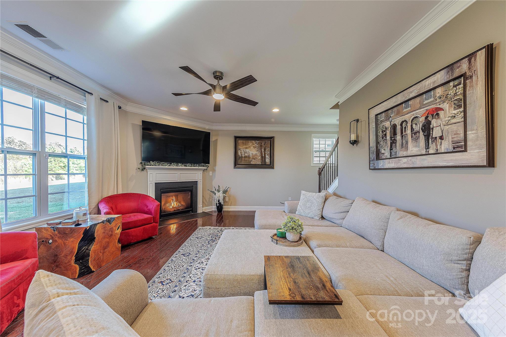 8344 Dallas Bay Road Charlotte, NC 28278 - Photo 12 of 25 a living room with furniture a fireplace and a flat screen tv