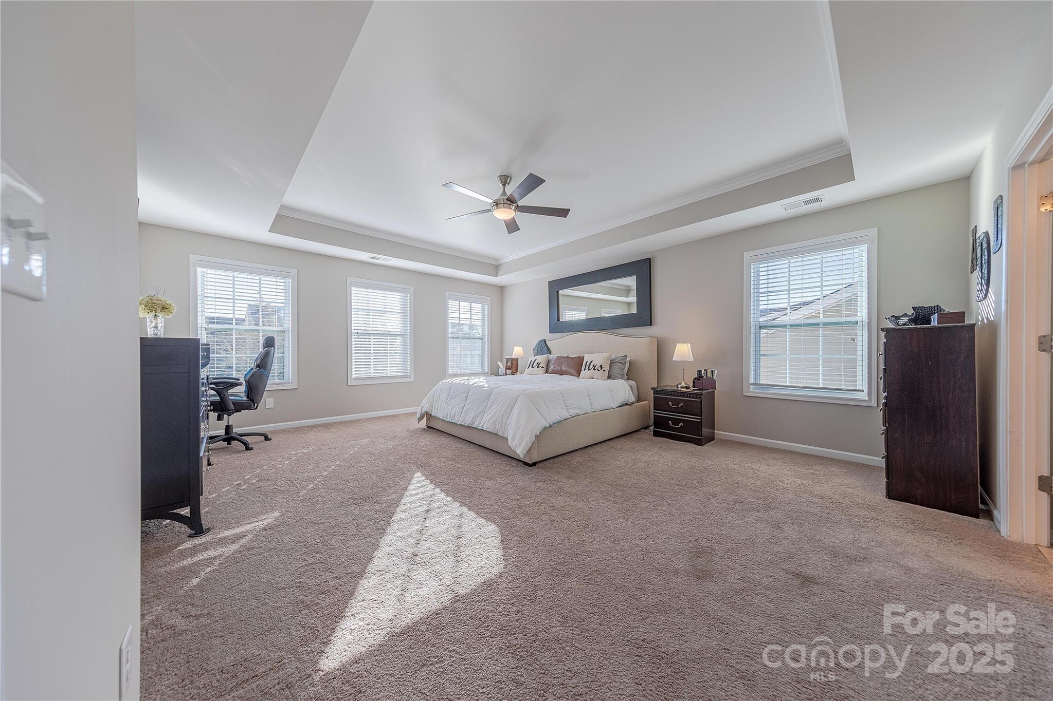 8344 Dallas Bay Road Charlotte, NC 28278 - Photo 17 of 25 a spacious bedroom with a bed couch and a window