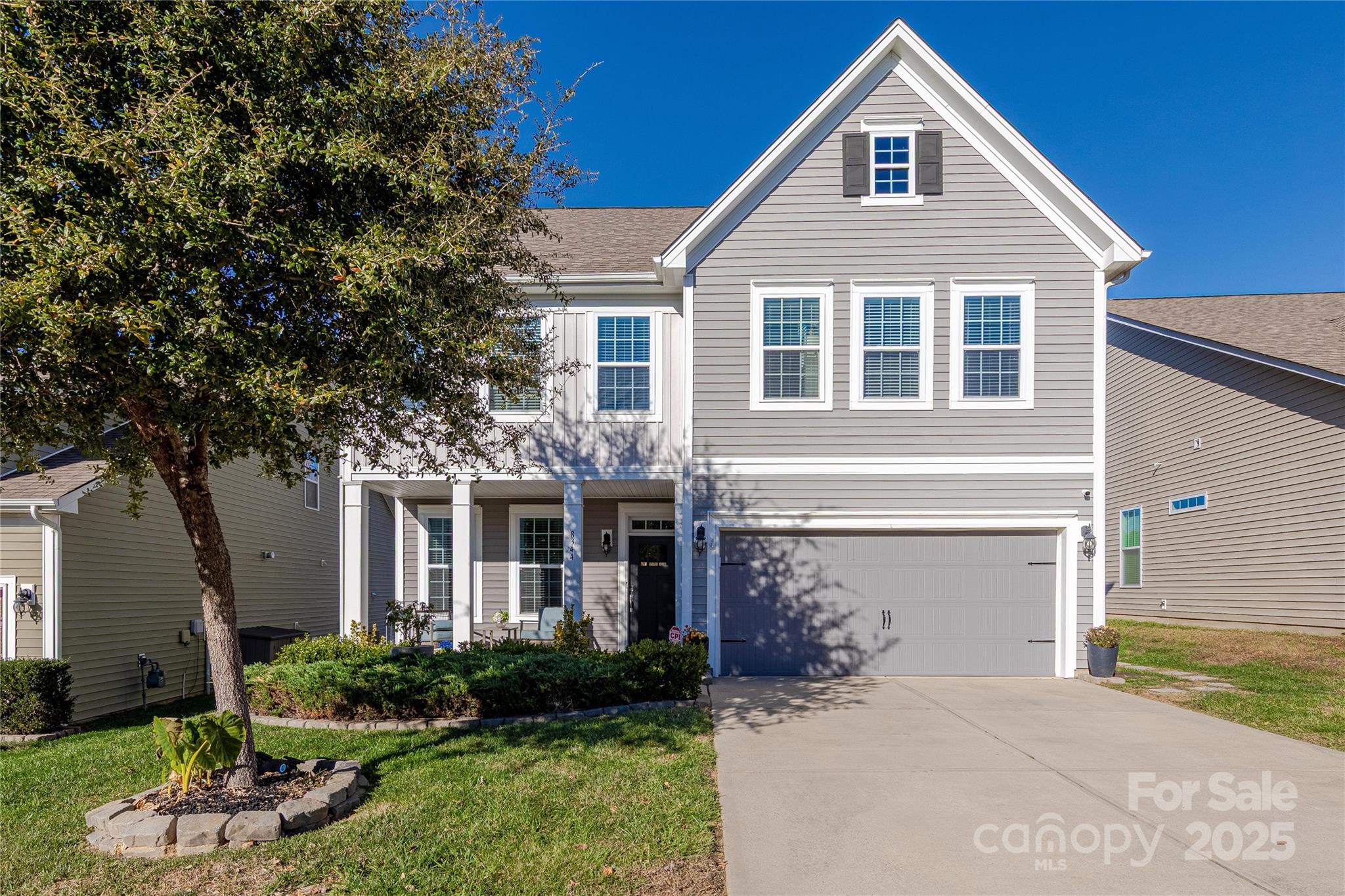 8344 Dallas Bay Road Charlotte, NC 28278 - Photo 2 of 25 a front view of a house with a yard and porch