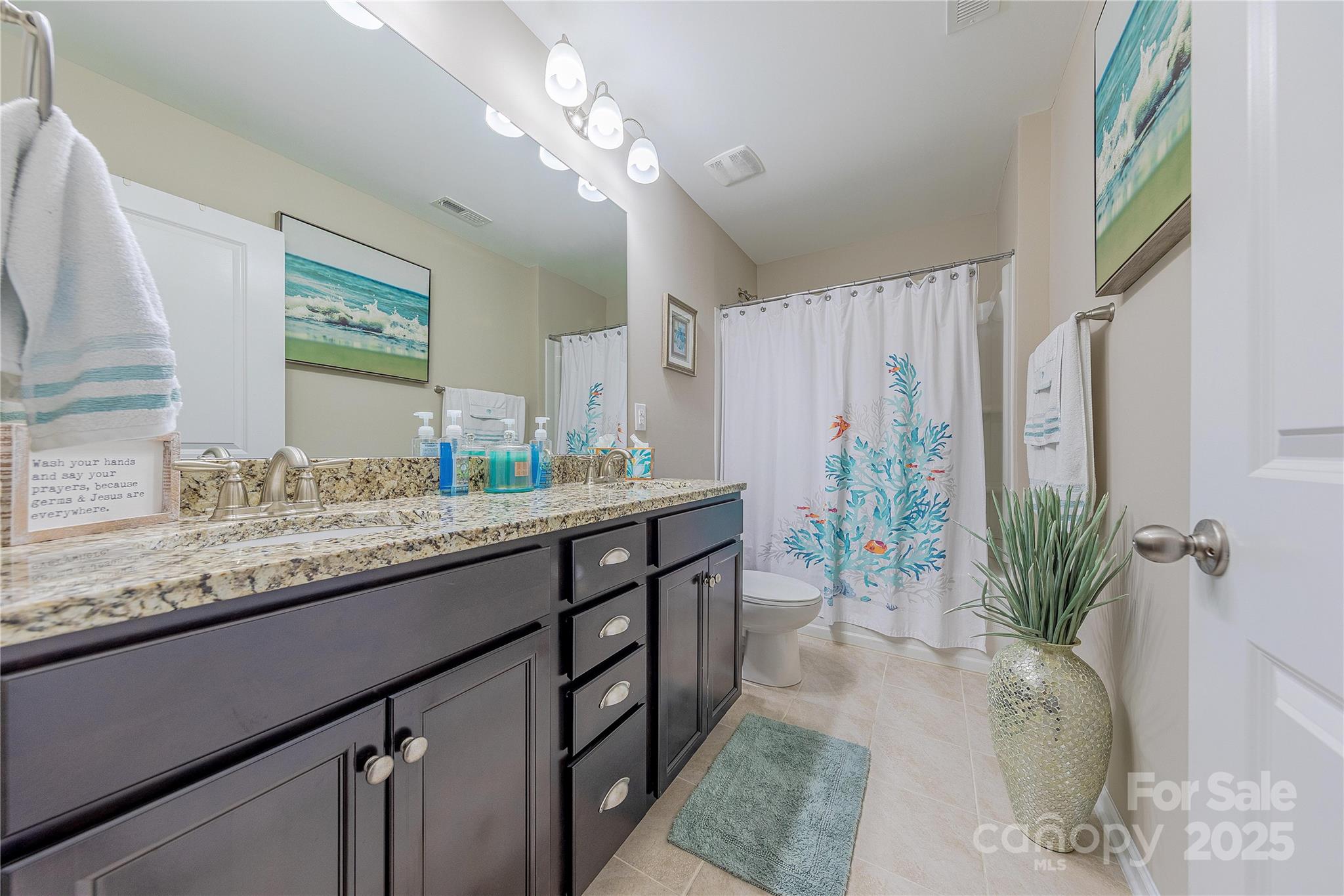 8344 Dallas Bay Road Charlotte, NC 28278 - Photo 24 of 25 a bathroom with a granite countertop sink a large mirror and a shower