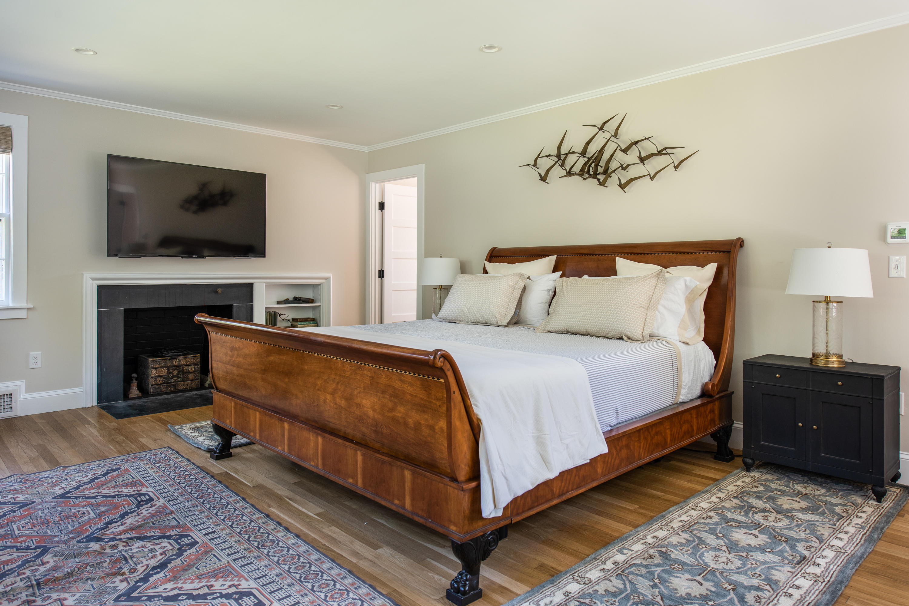 5 Smiths Point Road West Yarmouth, MA 02673 - Photo 21 of 31 a spacious bedroom with a bed and a flat screen tv