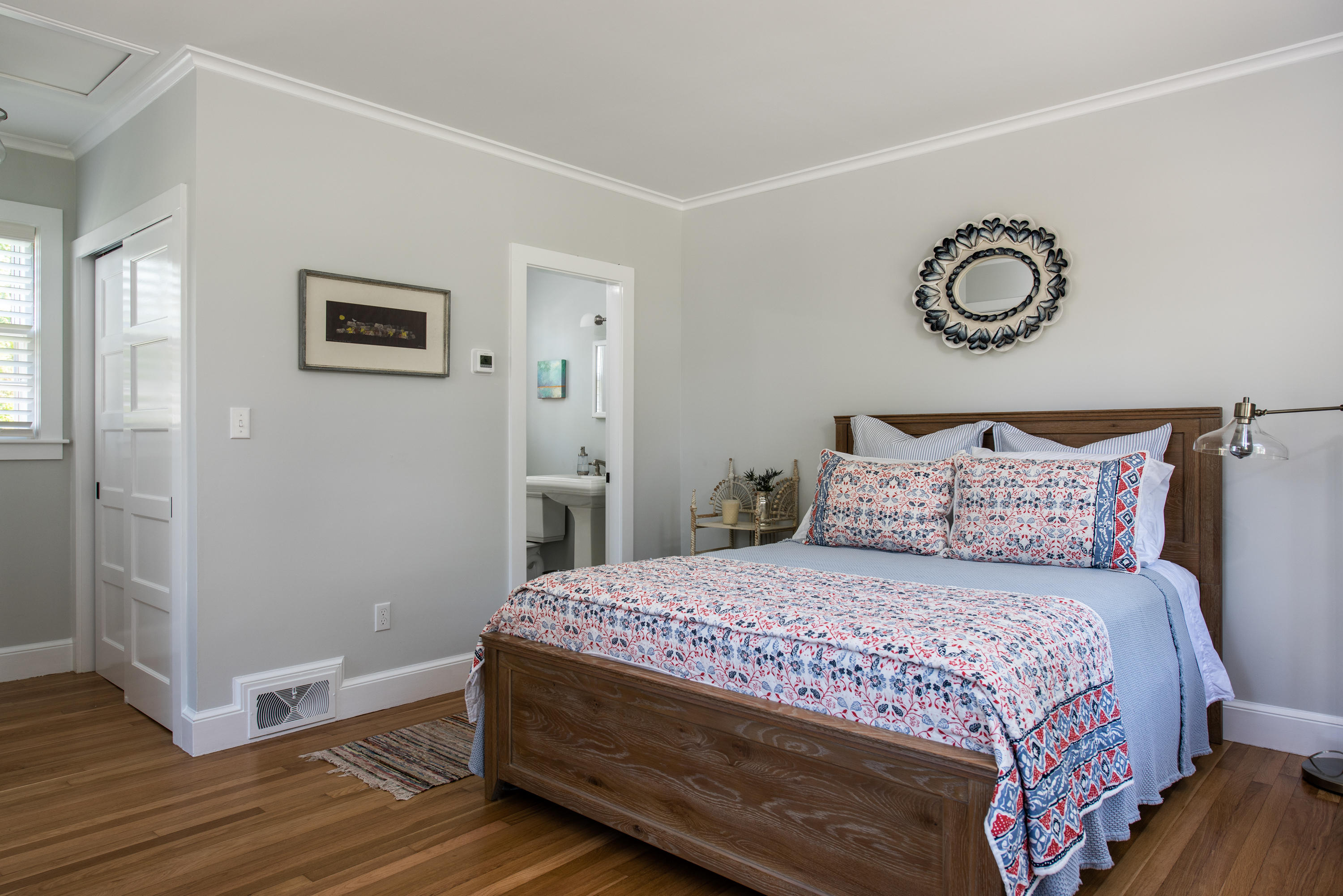 5 Smiths Point Road West Yarmouth, MA 02673 - Photo 24 of 31 a bedroom with a bed and a lamp