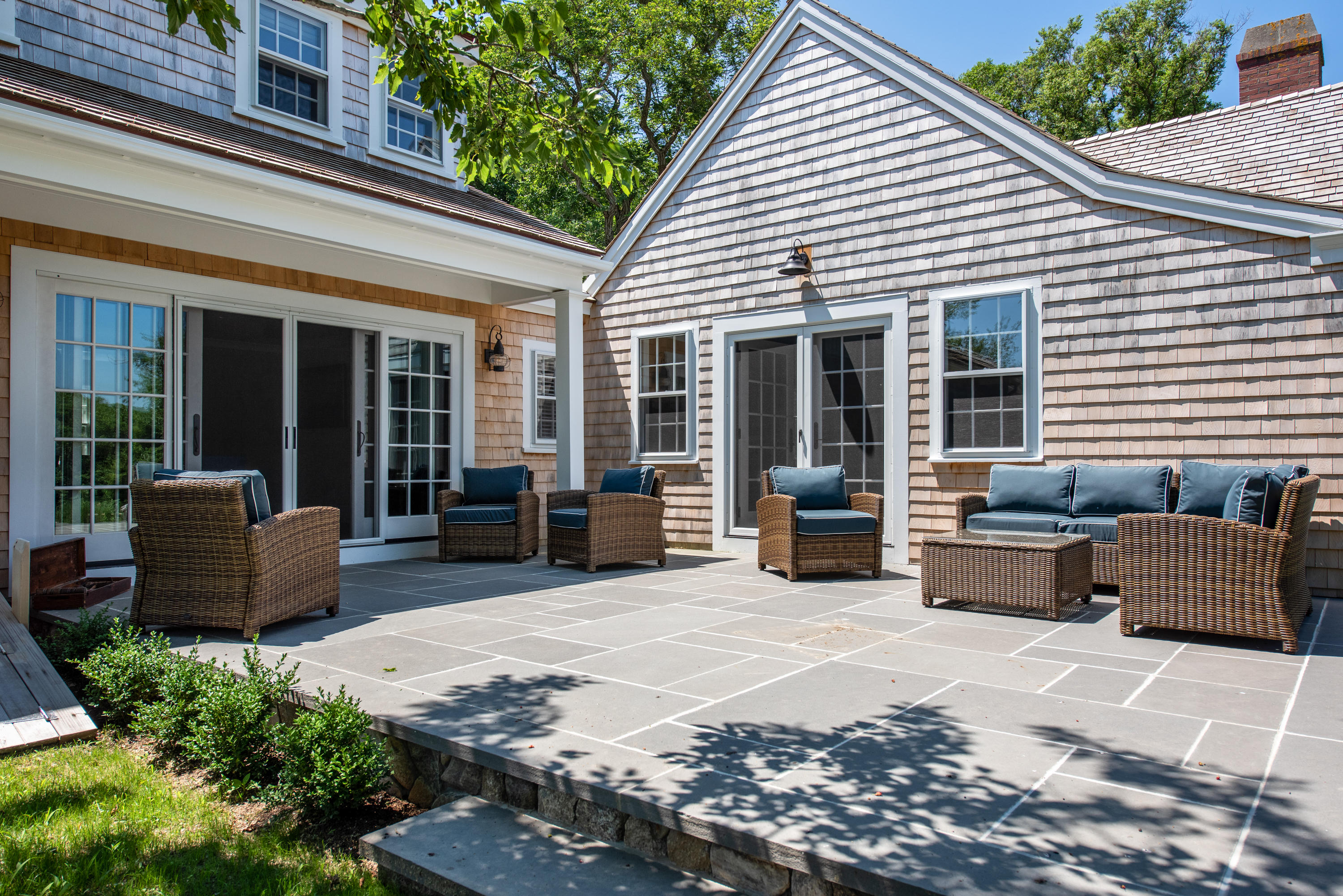 5 Smiths Point Road West Yarmouth, MA 02673 - Photo 25 of 31 a view of a patio with couches table and chairs and potted plants