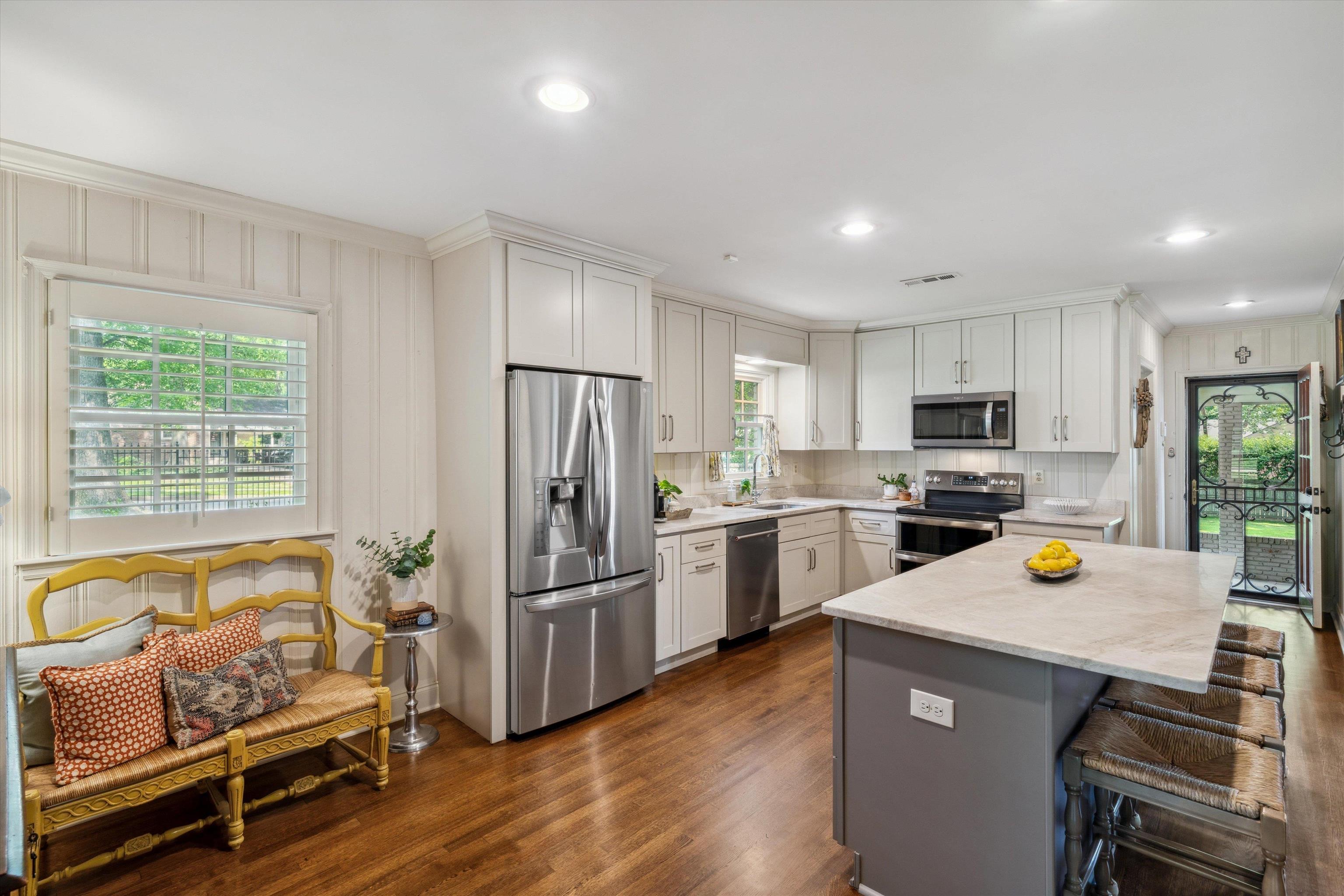 5265 South Angela Road Memphis, TN 38120 - Photo 5 of 26 a kitchen with a refrigerator and wooden floor