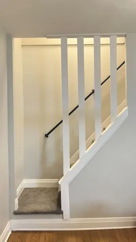 a bathroom with a shower and a mirror