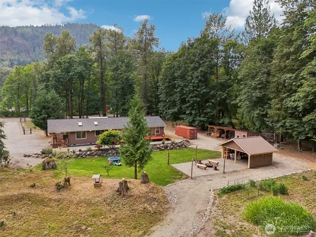 an aerial view of a house with a big yard
