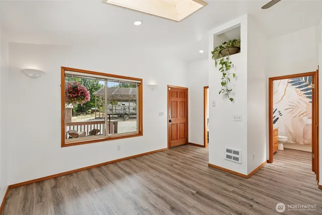 a view of living room with furniture and window