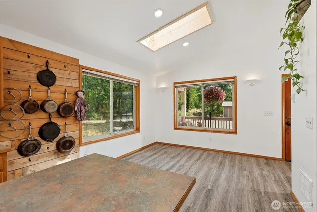 a view of a livingroom with furniture and a ceiling fan
