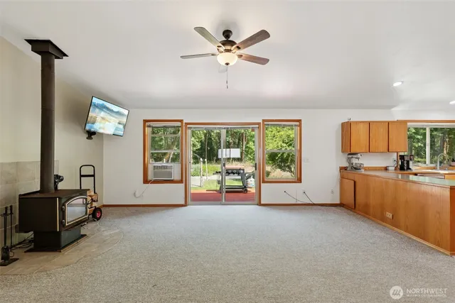 a spacious bedroom with a bed and large windows