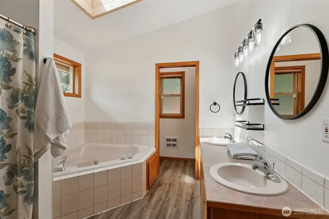 an aerial view of a houses with a lake view