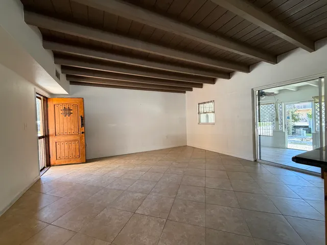 a view of an empty room and a window