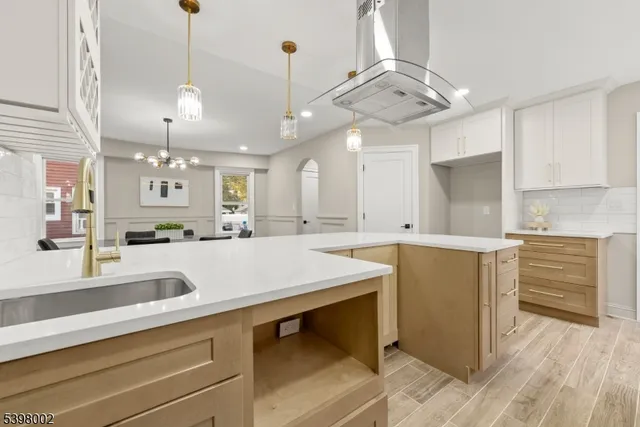 a kitchen with a sink cabinets and window