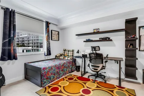 a bedroom with bed and a window