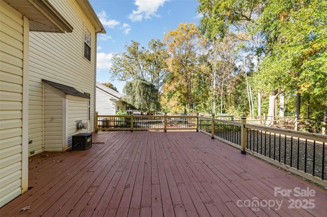 a view of a terrace with wooden floor and fence