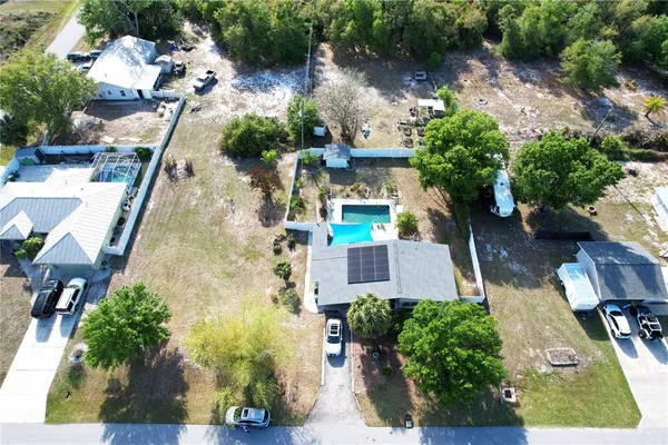 an aerial view of multiple houses with yard