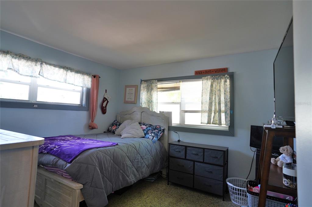 2357 Talbrook Terrace Punta Gorda, FL 33983 - Photo 12 of 55 a bedroom with a bed and a window