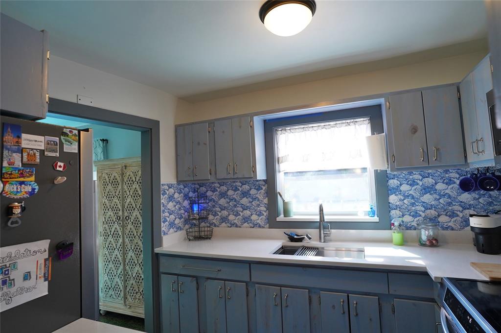 2357 Talbrook Terrace Punta Gorda, FL 33983 - Photo 20 of 55 a kitchen with stainless steel appliances a sink cabinets and a window