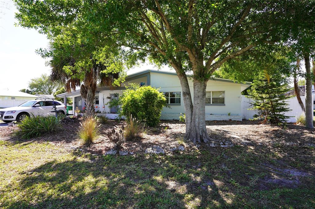2357 Talbrook Terrace Punta Gorda, FL 33983 - Photo 2 of 55 a front view of a house with garden