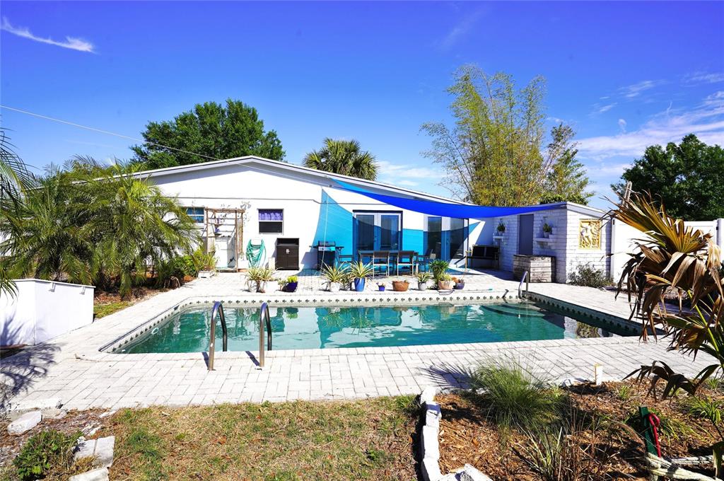 2357 Talbrook Terrace Punta Gorda, FL 33983 - Photo 22 of 55 a view of a house with backyard patio and sitting area