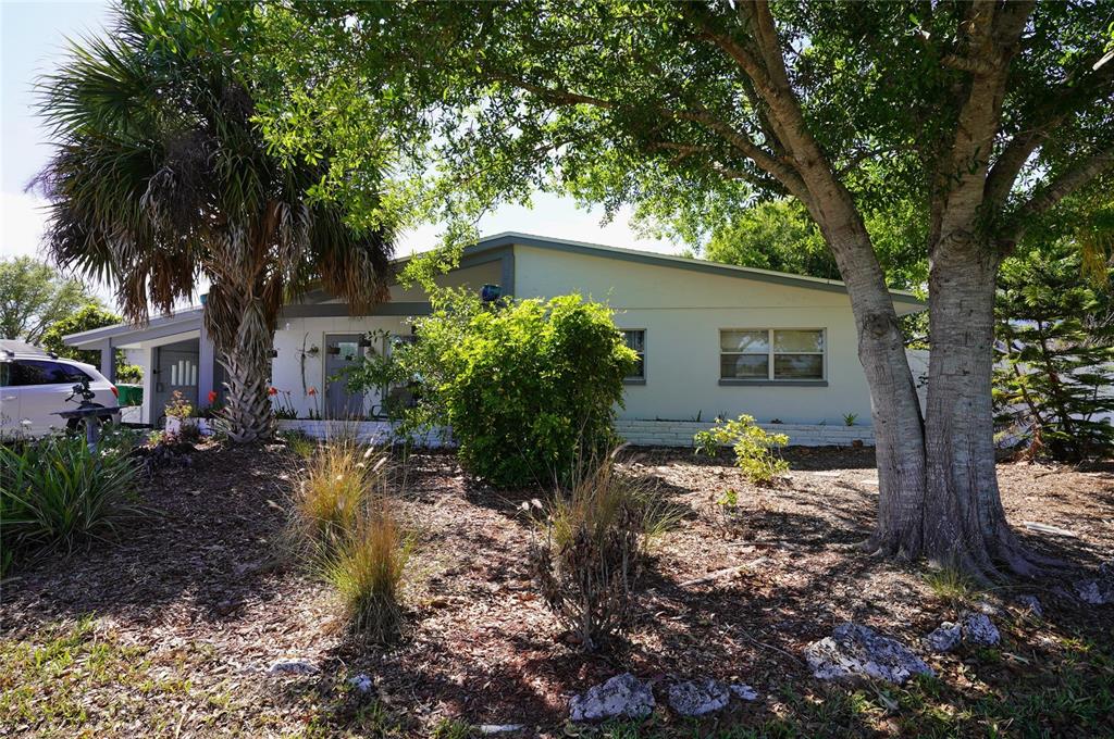 2357 Talbrook Terrace Punta Gorda, FL 33983 - Photo 3 of 55 a house that has a tree in front of the house