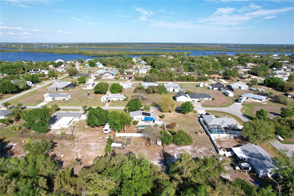2357 Talbrook Terrace Punta Gorda, FL 33983 - Photo 31 of 55 an aerial view of a city with lots of residential buildings and ocean view in back