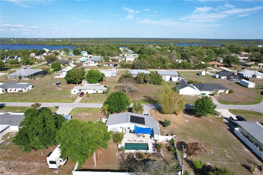 2357 Talbrook Terrace Punta Gorda, FL 33983 - Photo 34 of 55 an aerial view of a city with lots of residential buildings and ocean view in back