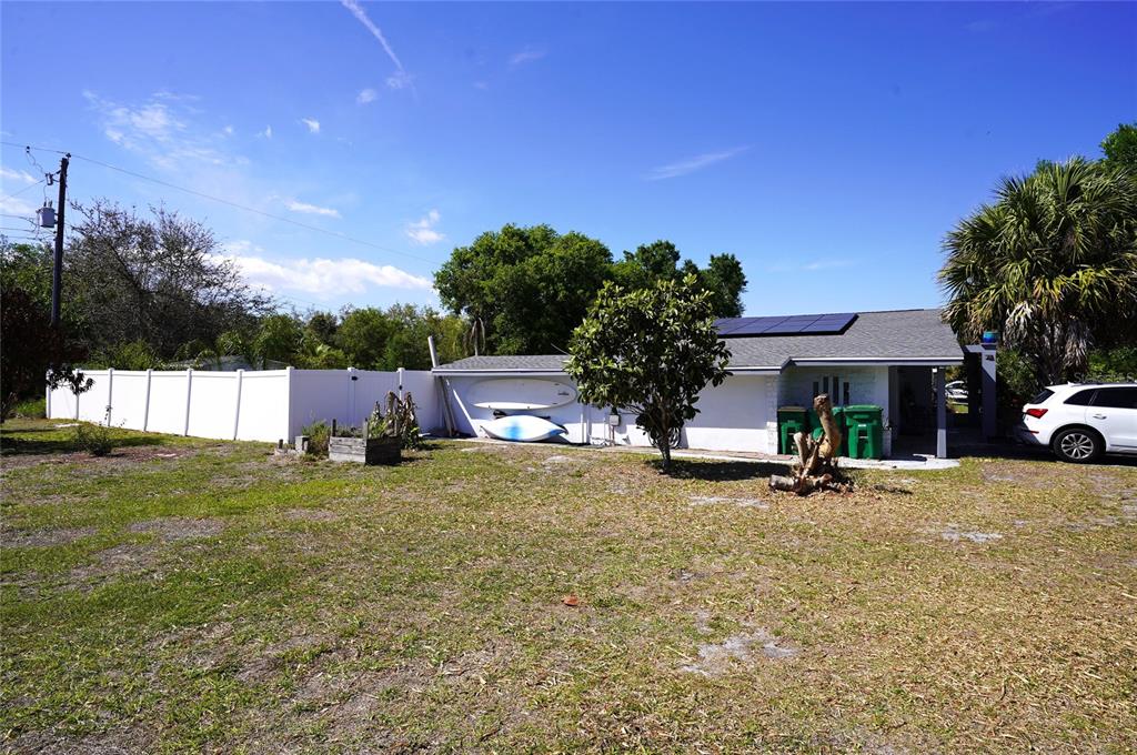 2357 Talbrook Terrace Punta Gorda, FL 33983 - Photo 5 of 55 a backyard of a house with table and chairs