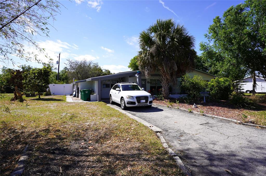 2357 Talbrook Terrace Punta Gorda, FL 33983 - Photo 6 of 55 a house with trees in front of it