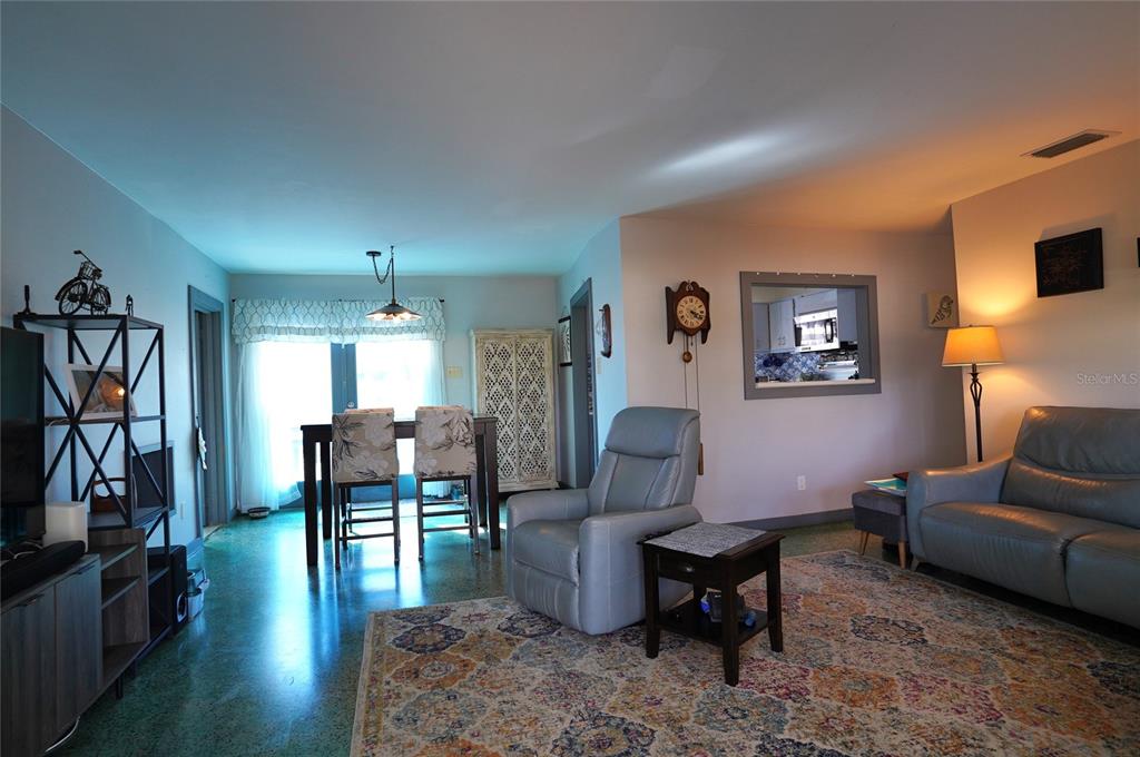 2357 Talbrook Terrace Punta Gorda, FL 33983 - Photo 9 of 55 a living room with furniture and a flat screen tv