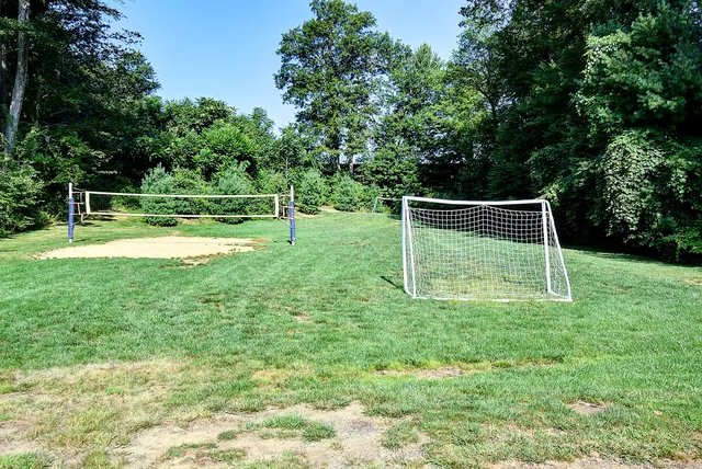 a view of a backyard with a trampoline