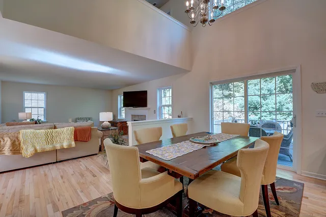 a view of a dining room with furniture window and wooden floor