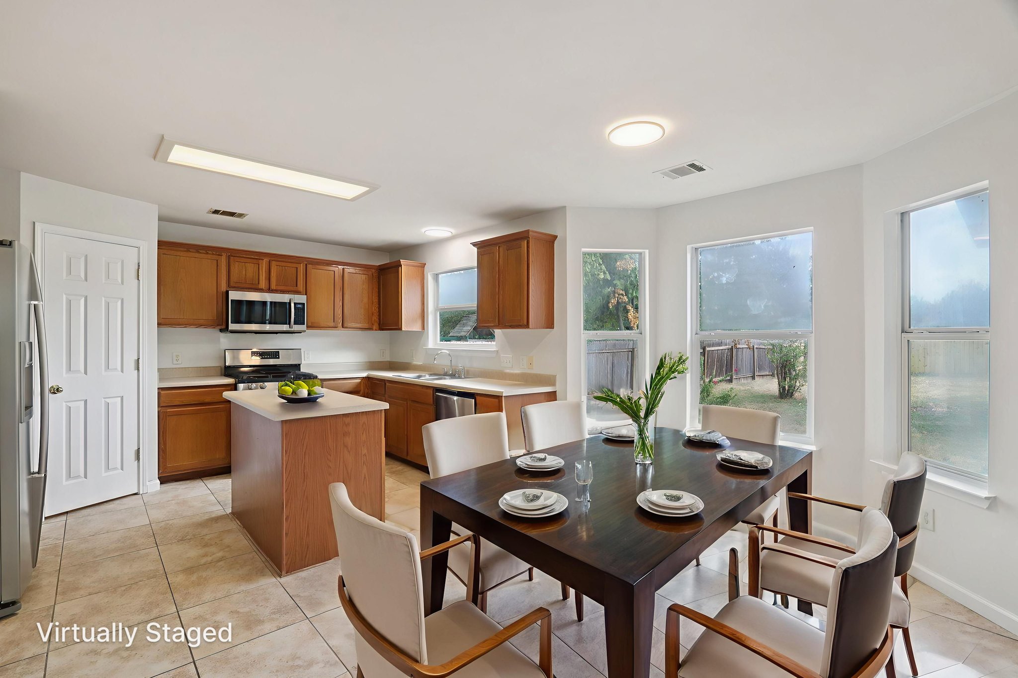 14521 Ballycastle Trail Austin, TX 78717 - Photo 18 of 40 a view of a dining room with furniture and a potted plant