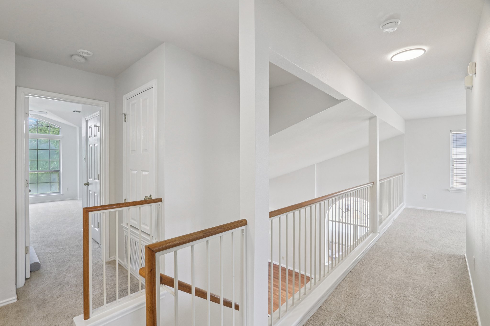 14521 Ballycastle Trail Austin, TX 78717 - Photo 24 of 40 a view of staircase with railing and white walls