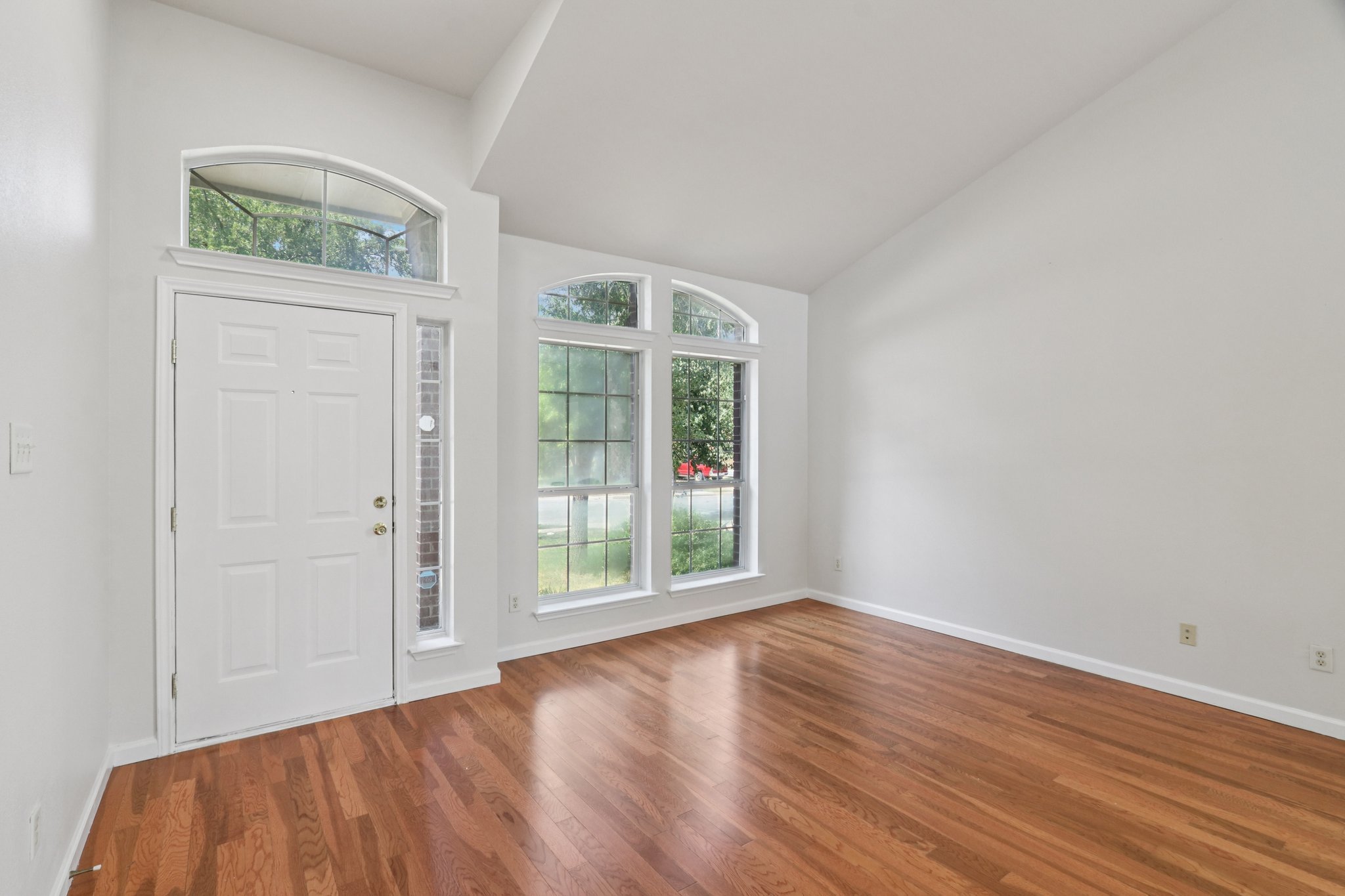 14521 Ballycastle Trail Austin, TX 78717 - Photo 4 of 40 an empty room with wooden floor and windows