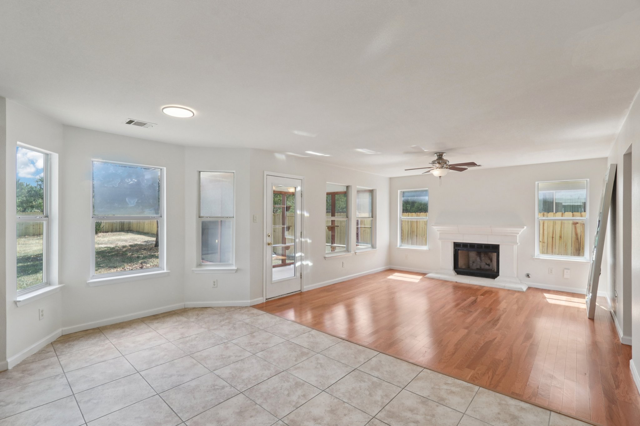 14521 Ballycastle Trail Austin, TX 78717 - Photo 9 of 40 a view of a livingroom with a fireplace window and wooden floor