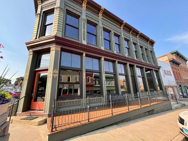 a view of a building with sitting area