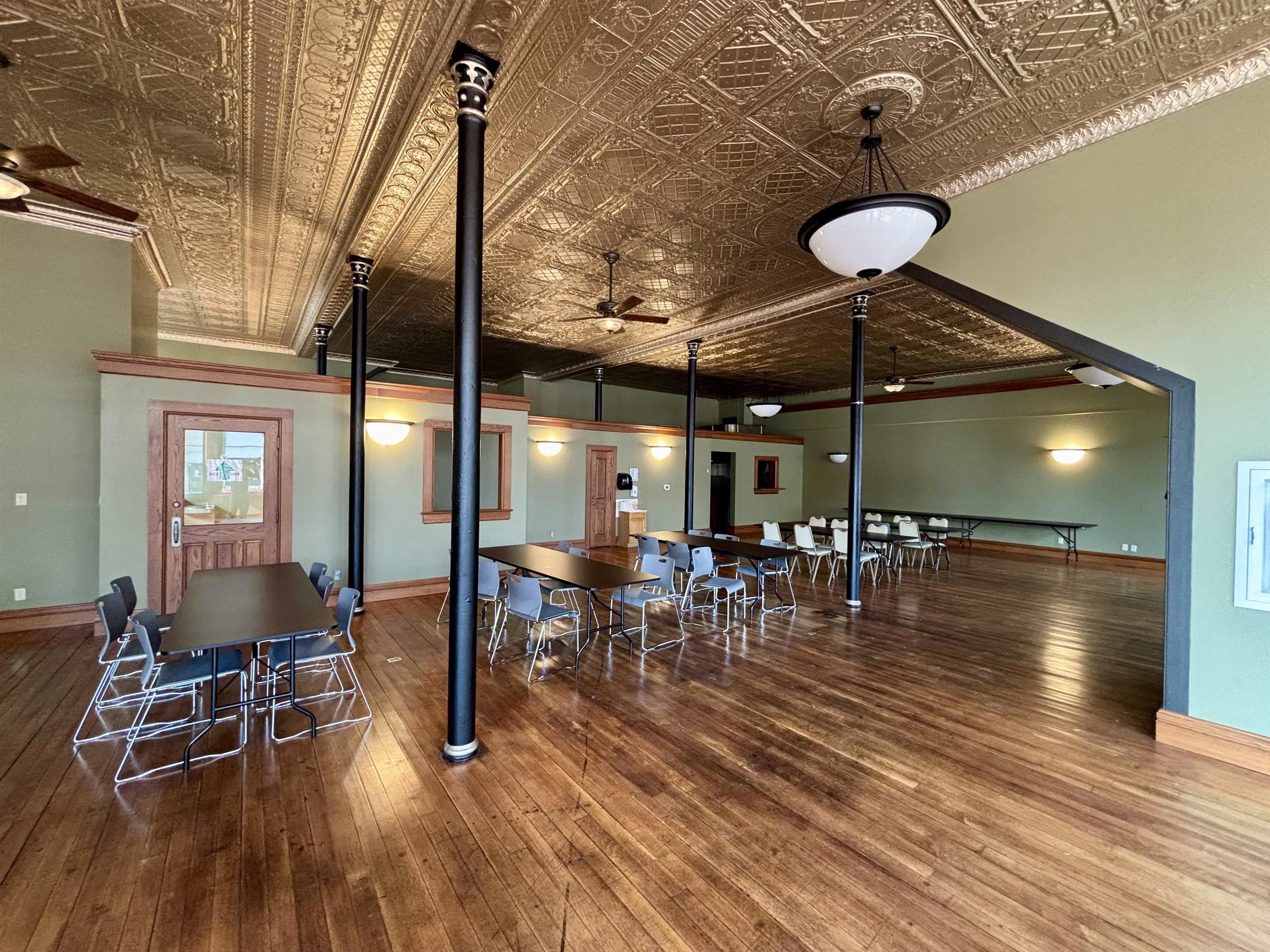 320 North Main Street Mount Carroll, IL 61053 - Photo 11 of 31 a view of a dining room with furniture and wooden floor