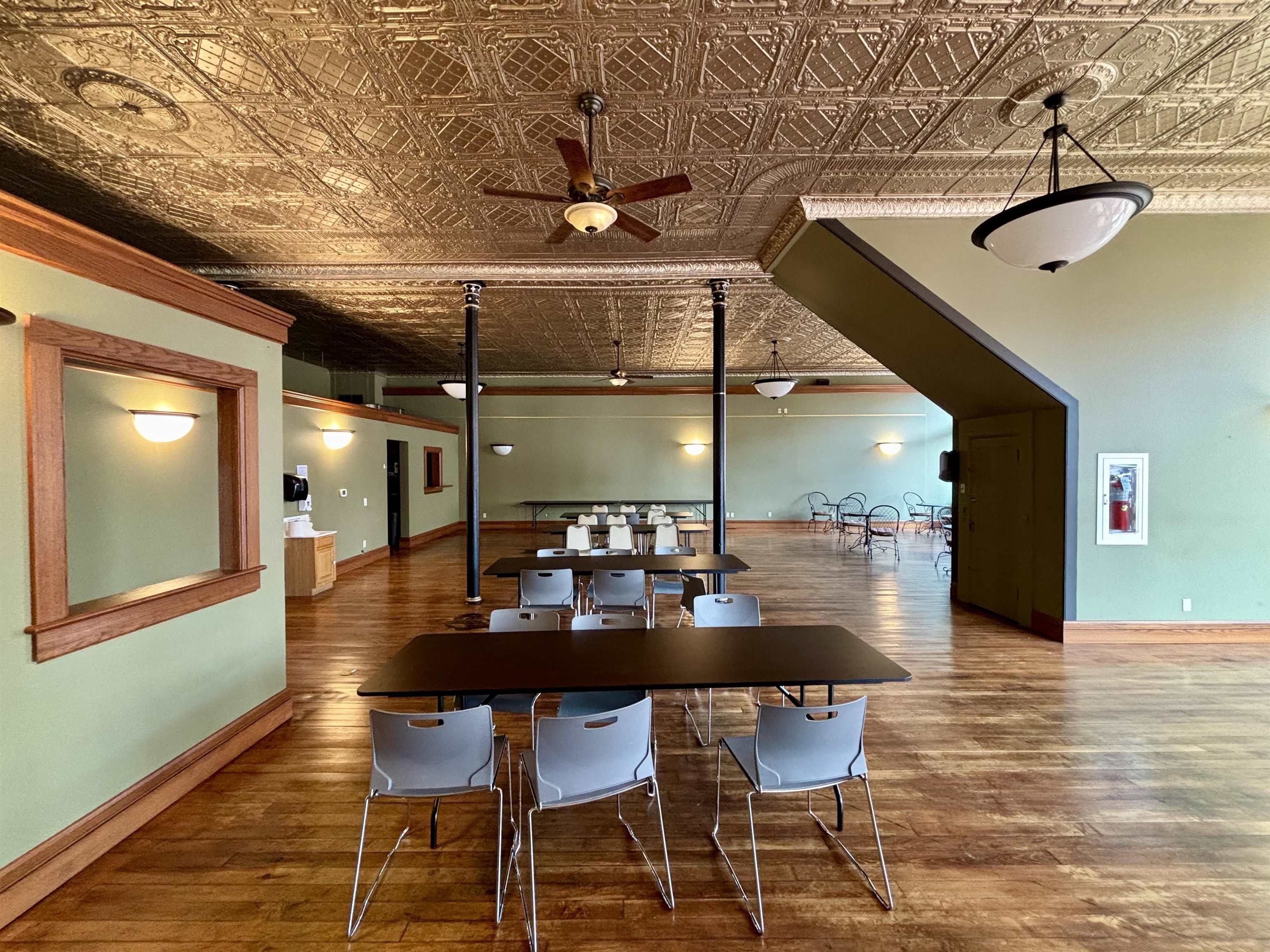 320 North Main Street Mount Carroll, IL 61053 - Photo 12 of 31 a dining room with furniture and wooden floor