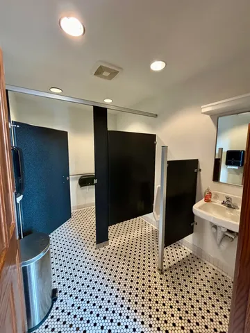 a kitchen with stainless steel appliances kitchen island granite countertop a sink and cabinets