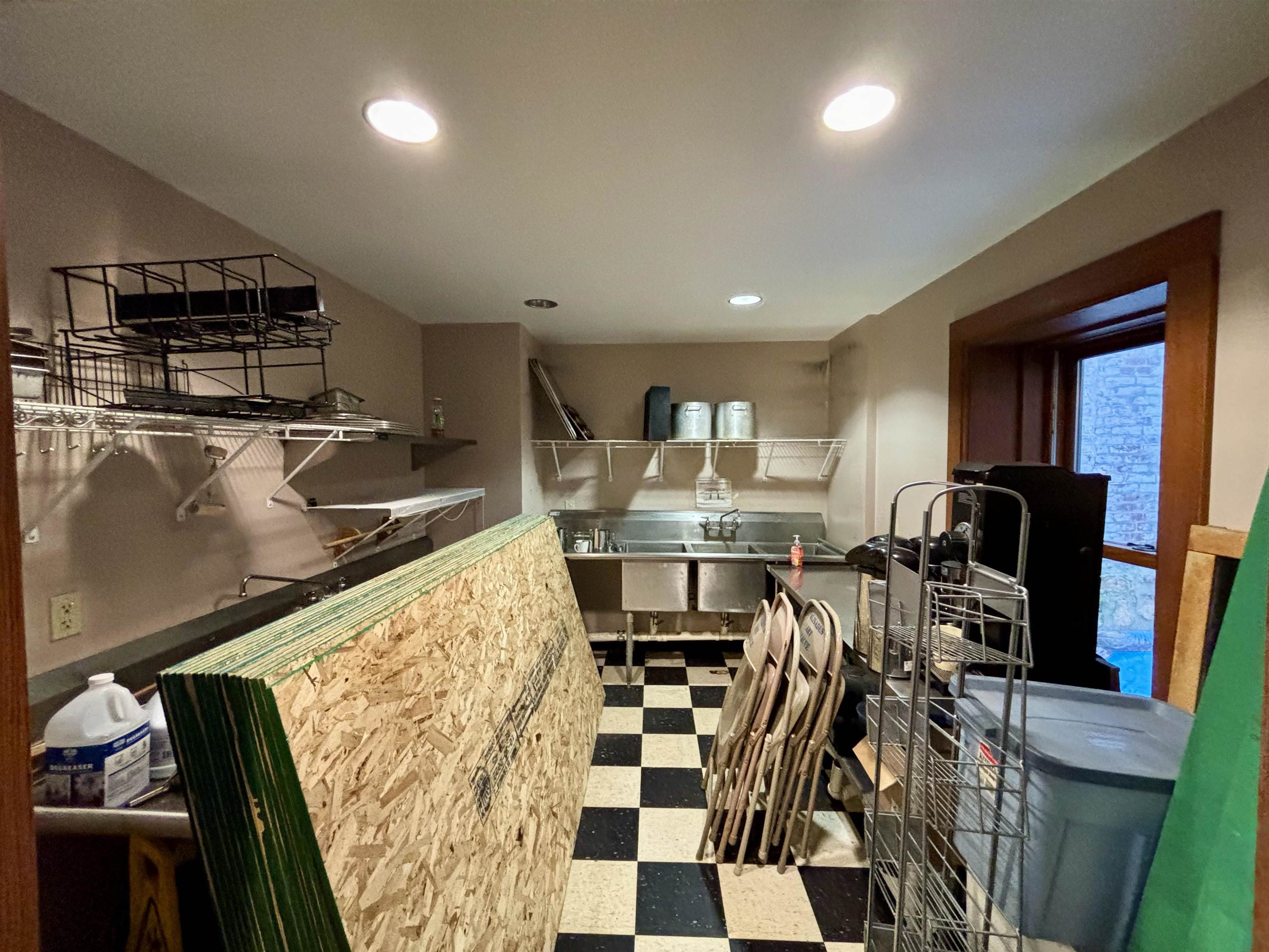 320 North Main Street Mount Carroll, IL 61053 - Photo 20 of 31 a kitchen with stainless steel appliances kitchen island granite countertop a sink and cabinets
