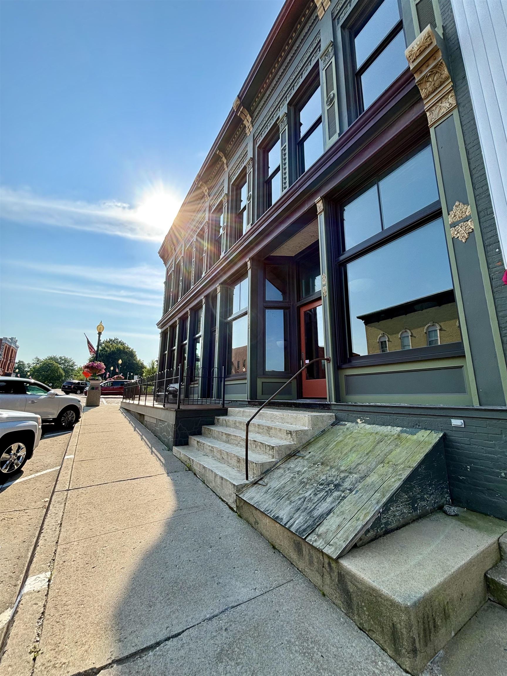 320 North Main Street Mount Carroll, IL 61053 - Photo 3 of 31 a view of a building with car parked