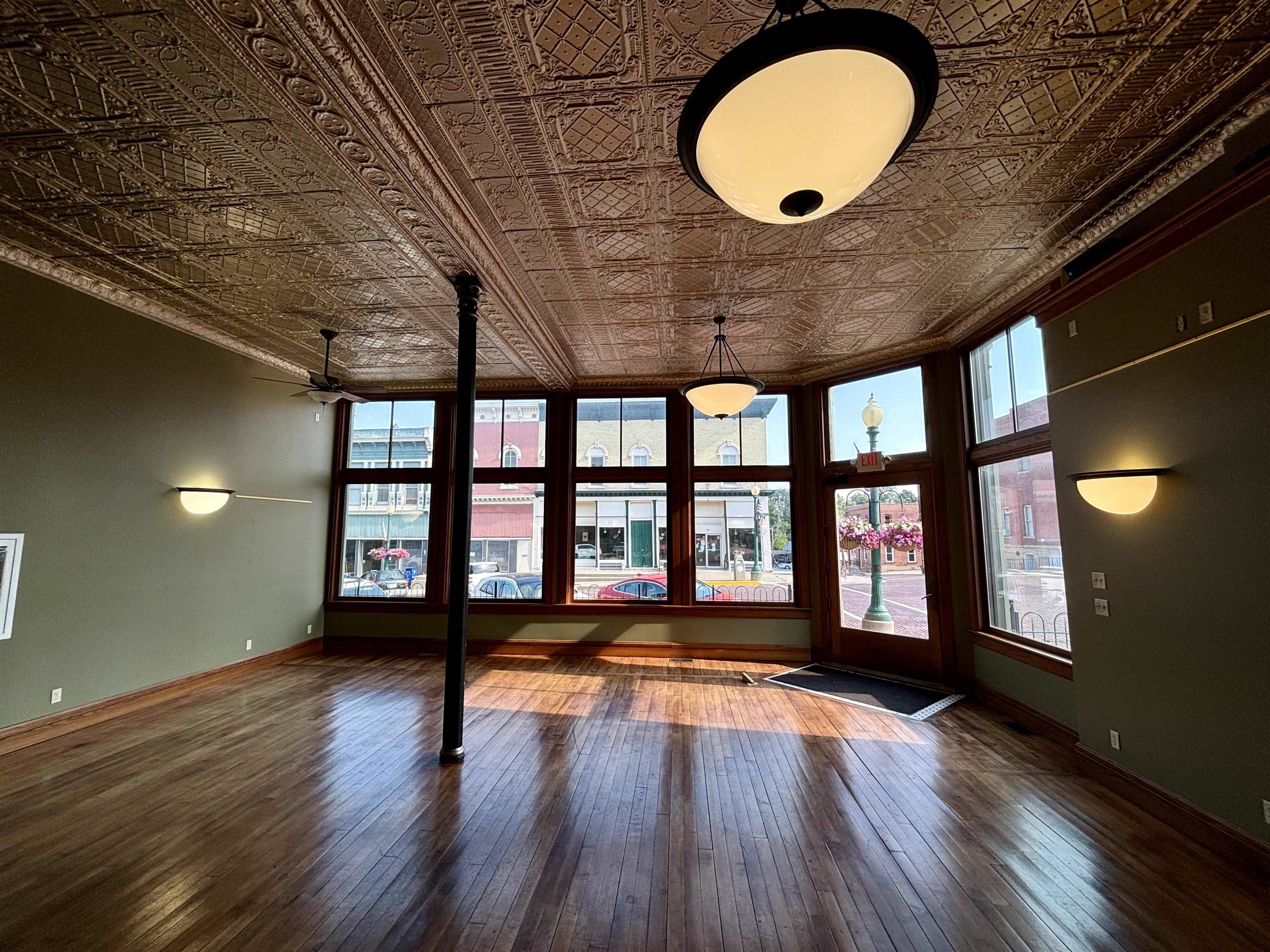 320 North Main Street Mount Carroll, IL 61053 - Photo 8 of 31 wooden floor in an empty room with a window
