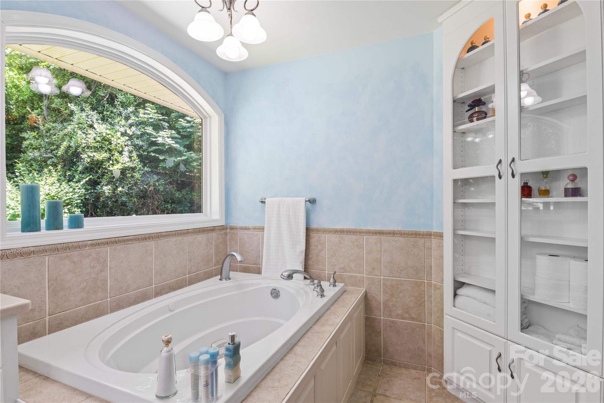 3 Northwood Road Asheville, NC 28804 - Photo 23 of 48 a bathroom with a tub a sink and a large window