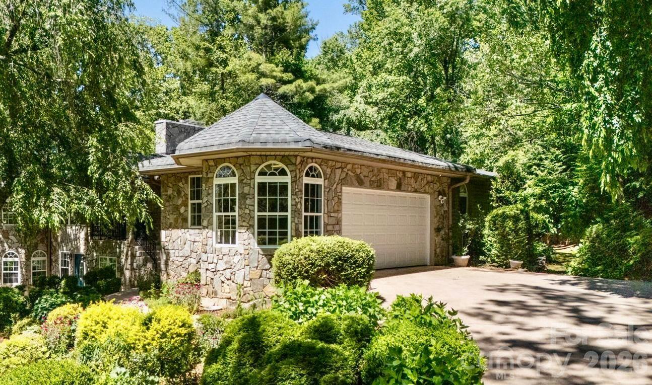 3 Northwood Road Asheville, NC 28804 - Photo 5 of 48 a front view of a house with a yard