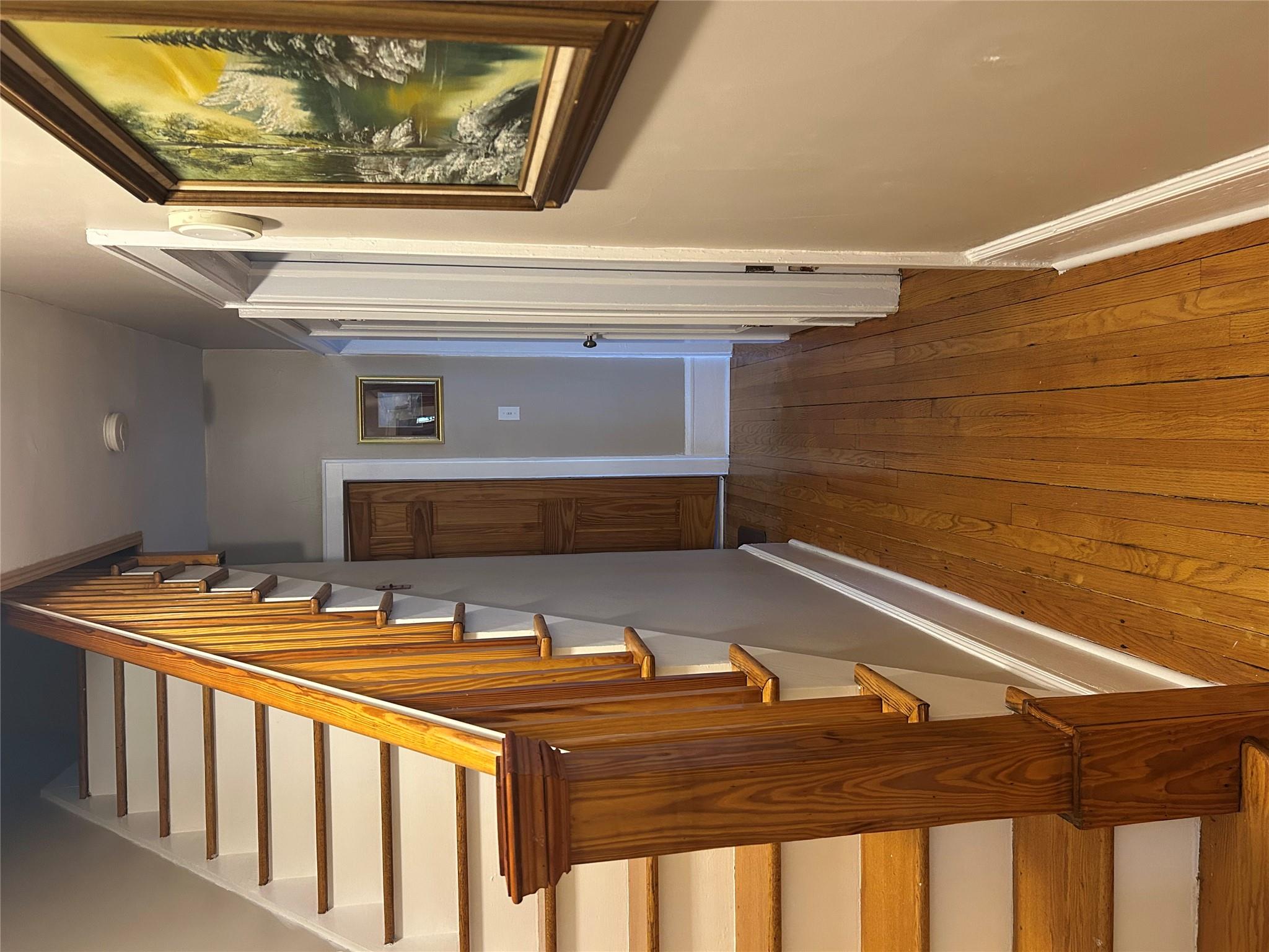 199 Washington Street Poughkeepsie, NY 12601 - Photo 11 of 32 Corridor with stairs, dark wood finished floors, and baseboards