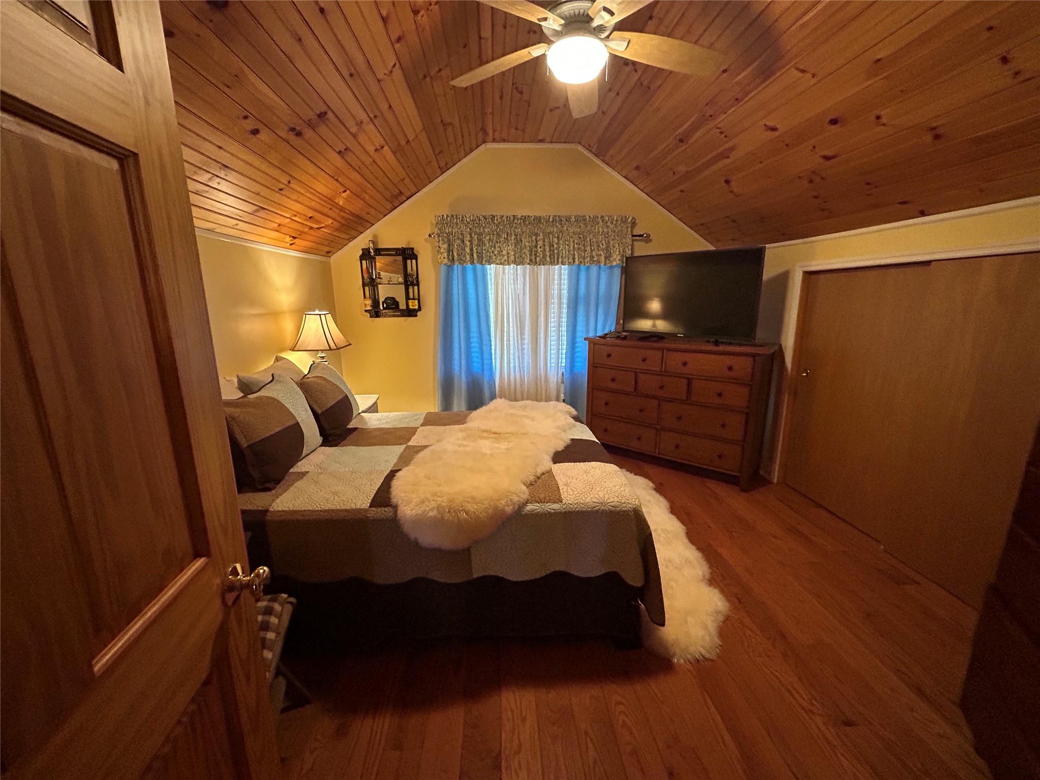 199 Washington Street Poughkeepsie, NY 12601 - Photo 23 of 32 Bedroom featuring lofted ceiling, wooden ceiling, wood finished floors, and a ceiling fan